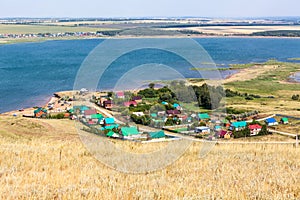 The Aslykul is the largest lake in the republic of Bashkortostan. Small village is close to water. Nature park the Asly-Kul