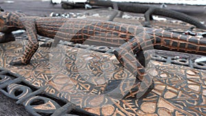 Asmat wood carving made of iron wood showing a crocodile