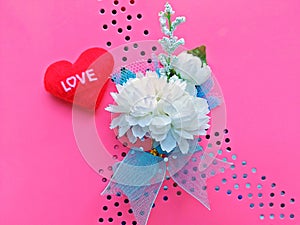 Asmine flowers and heart on a pink background ( Artificial Flowers)