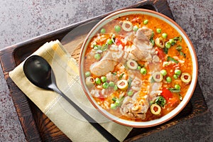 Asopao de Pollo this comforting Puerto Rican chicken and rice gumbo dish is loved throughout the Caribbean closeup on the bowl. photo