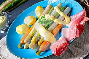 Asparagus with black forest ham, carrots and hollandaise sauce