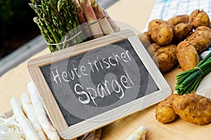 Asparagus with blackboard and german words