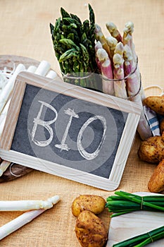 Asparagus with blackboard the word bio