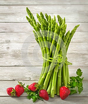 Asparagus on bright pale wood