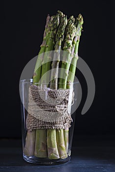 Asparagus bundle on a black background