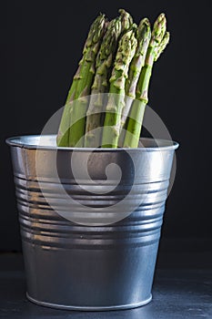 Asparagus bundle on a black background