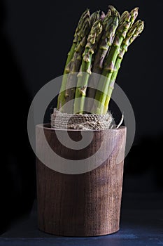 Asparagus bundle on a black background
