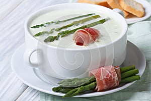 Asparagus cream soup with ham closeup