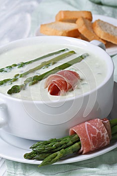 Asparagus cream soup with ham vertical