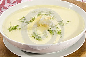 Asparagus cream soup in a white bowl