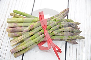 Asparagus fresh green vegetable food on wooden table