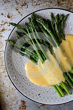 Asparagus in homemade hollandaise sauce photo