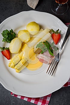 A asparagus with light ham and bechamel sauce photo