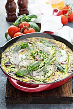 Asparagus, mushrooms and goat cheese frittata photo