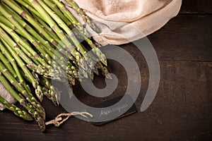 Asparagus over wooden background