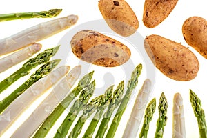 Asparagus and potatos isolated on white background