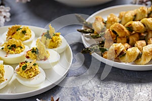 Asparagus in puff pastry and devilled eggs