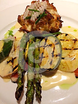 Asparagus in a rich sauce with grilled accompaniments