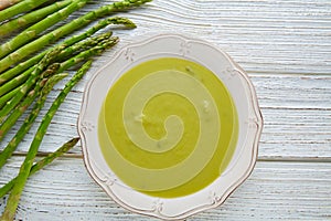 Asparagus soup green cream on white wood table