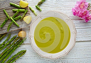Asparagus soup green cream on white wood table