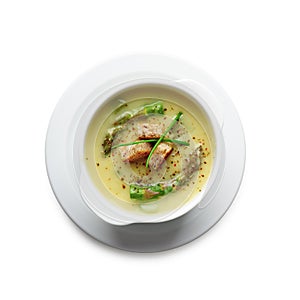 Asparagus soup in white bowl