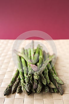Asparagus stalks on a woven mat