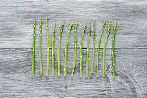 Asparagus on wooden background.