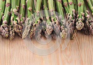 Asparagus on a wooden background.