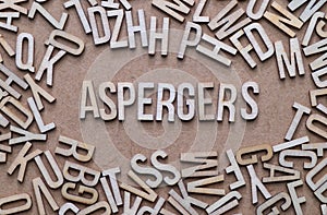 Aspergers concept, word spelled out in wooden letters