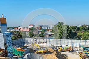 Asphalt and cement factory. Large piles of construction sand, gravel, limestone quarry, mining rocks used for asphalt