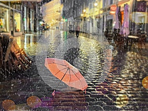Rainy street pink umbrella reflection wet asphalt city night raindrops water reflection autumn leaves  fall season city evening li