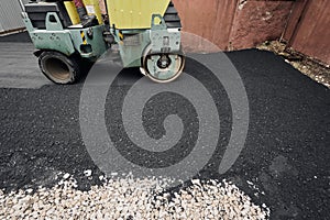 Asphalt Compactors is carrying out road repair work. Laying new asphalt. Large heavy machinery. Construction of a new