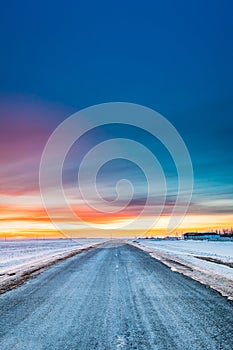 Asphalt Country Open Road Through Winter Snowy Fields And Meadow