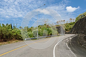 Asphalt curve road with lighting pole