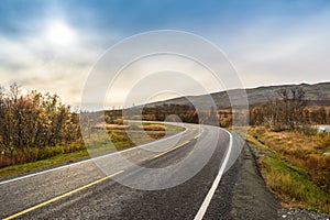 Asphalt curved road along mountain, Tromso, Norway