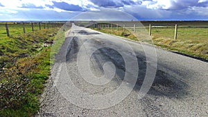 Asphalt deterioration on a road in Vitigudino, Spain, on a cloudy day