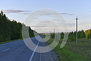 Asphalt high-speed highway in the forest in summer