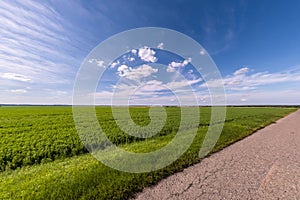 Asphalt highway empty road and clear blue sky with panoramic landscape