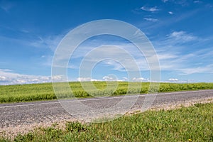 Asphalt highway empty road and clear blue sky with panoramic landscape