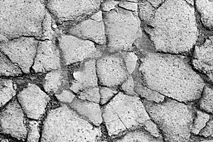 Asphalt pavement with cracks, old road close-up