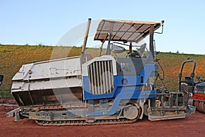 Asphalt paver on a construction site