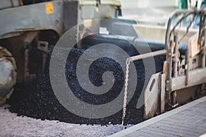 Asphalt paver machine and steam road roller during road construction and repairing works, process of asphalting and paving,