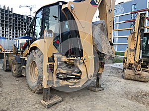 Asphalt paving machine. construction equipment. construction of a new microdistrict, creation of new roads in a microdistrict in