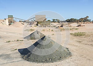 Asphalt Processing Machinery and Mounds of Waste.