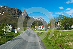 Asphalt road across norwegian village photo