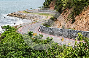 Asphalt road along tropical sea coastline