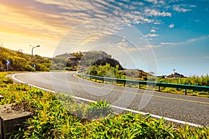 Asphalt road and sky at sunset