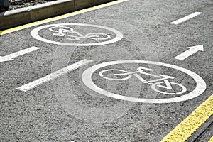 Asphalt road with bicycle and electric transport lane. Cycle and zero emission vehicles white sign on floor