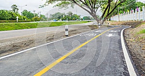 asphalt road and bike lane with sign