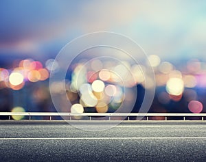 Asphalt road and blurred city